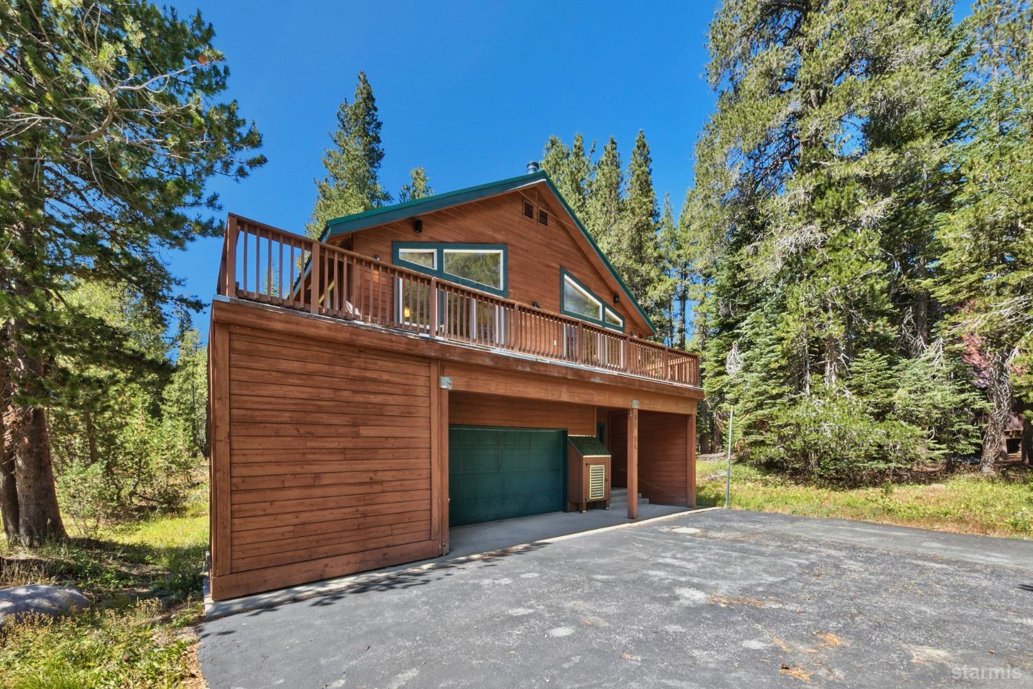 34235 Fremont Road Kirkwood, CA 95646 - Photo 28 of 29 a front view of a house with a yard and garage