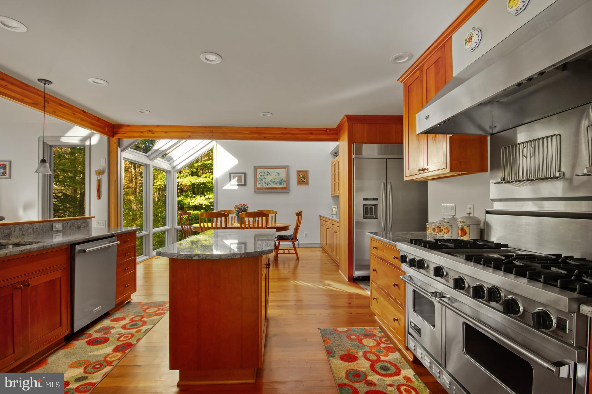 201 Biggs Purchase Lane Lothian, MD 20711 - Photo 12 of 42 a kitchen with stainless steel appliances granite countertop a stove a sink dishwasher and cabinets with wooden floor