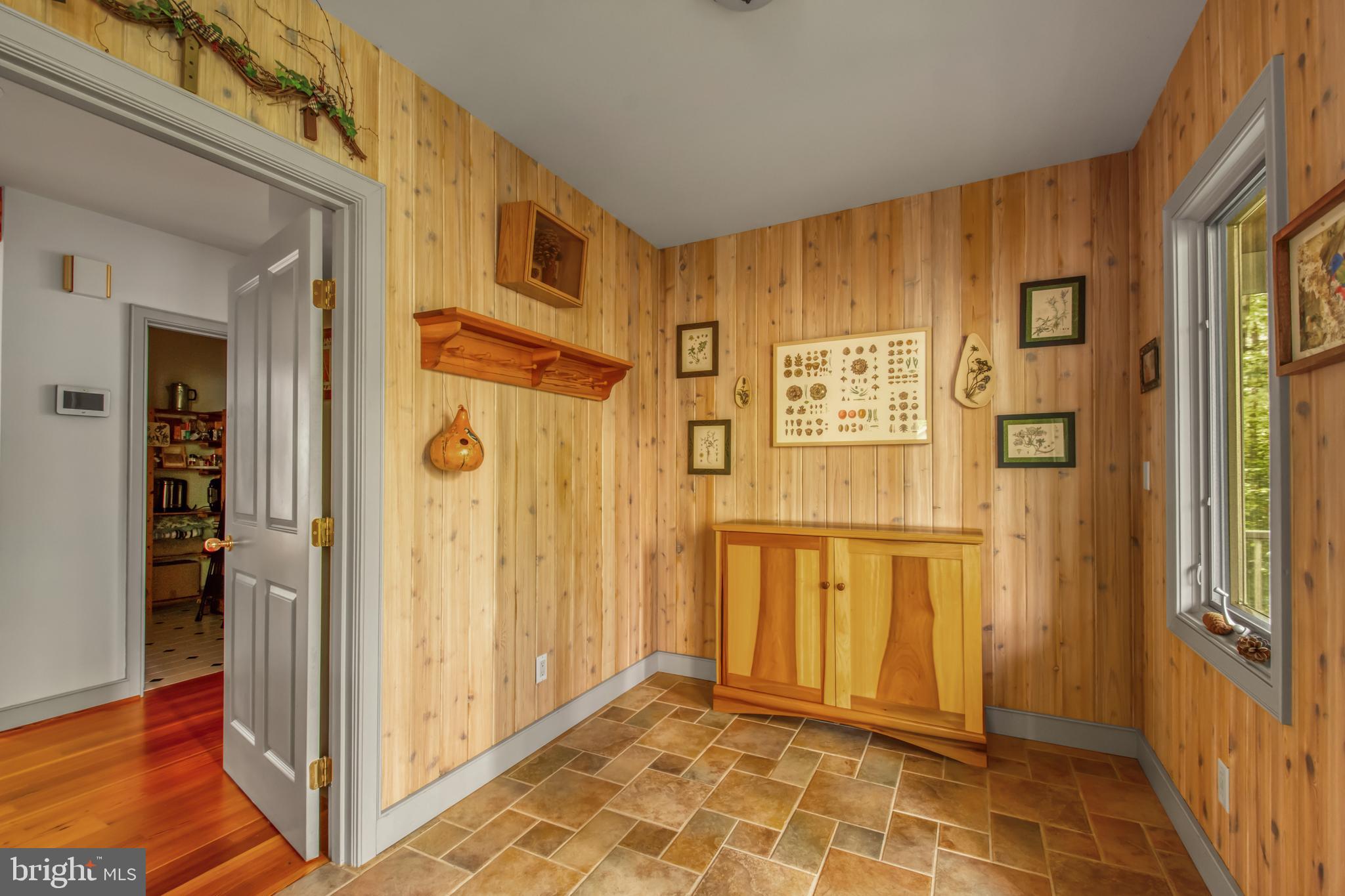 201 Biggs Purchase Lane Lothian, MD 20711 - Photo 18 of 42 a view of a hallway with wooden floor and cabinet
