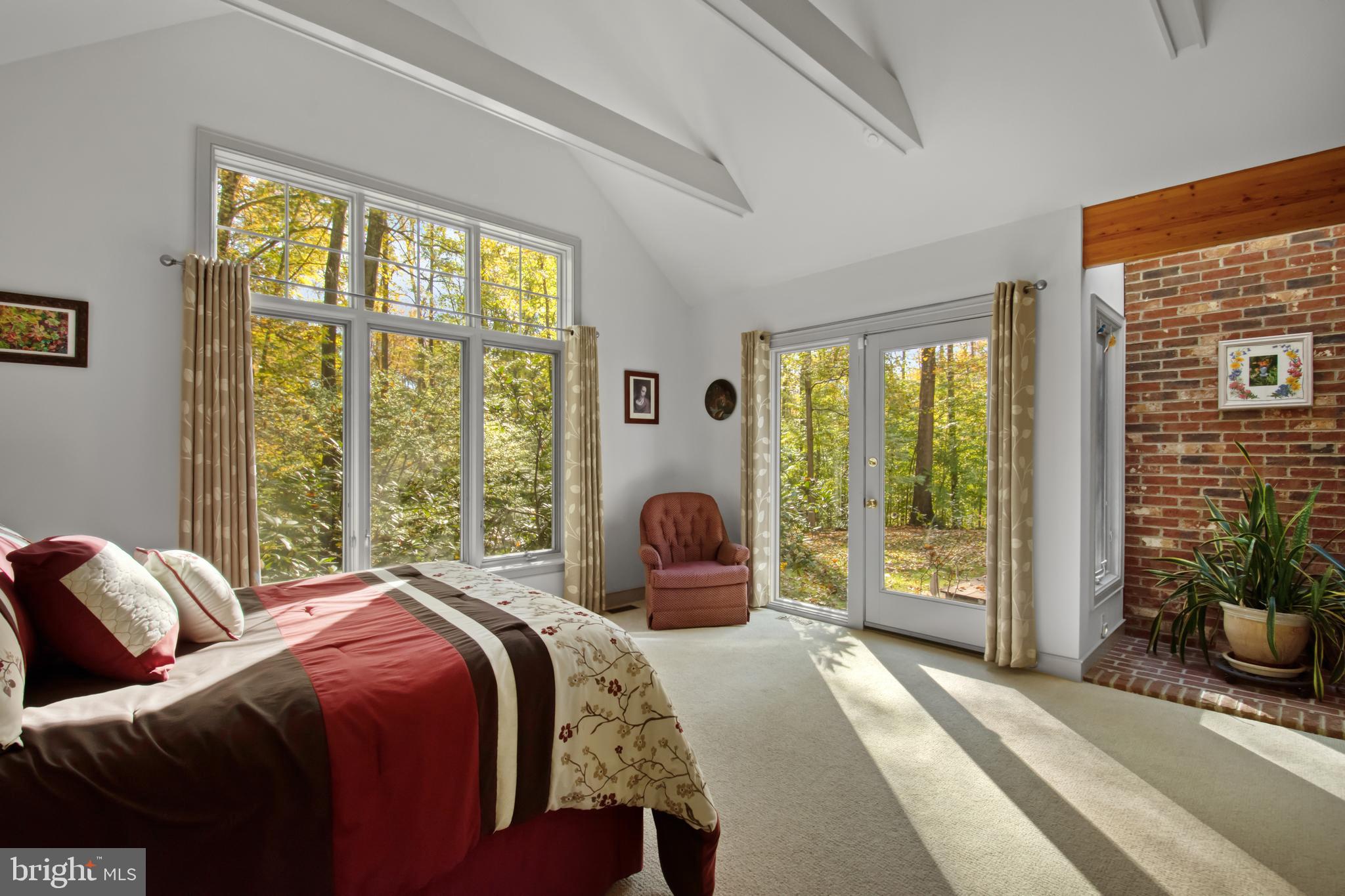 201 Biggs Purchase Lane Lothian, MD 20711 - Photo 23 of 42 a bedroom with a bed and large windows