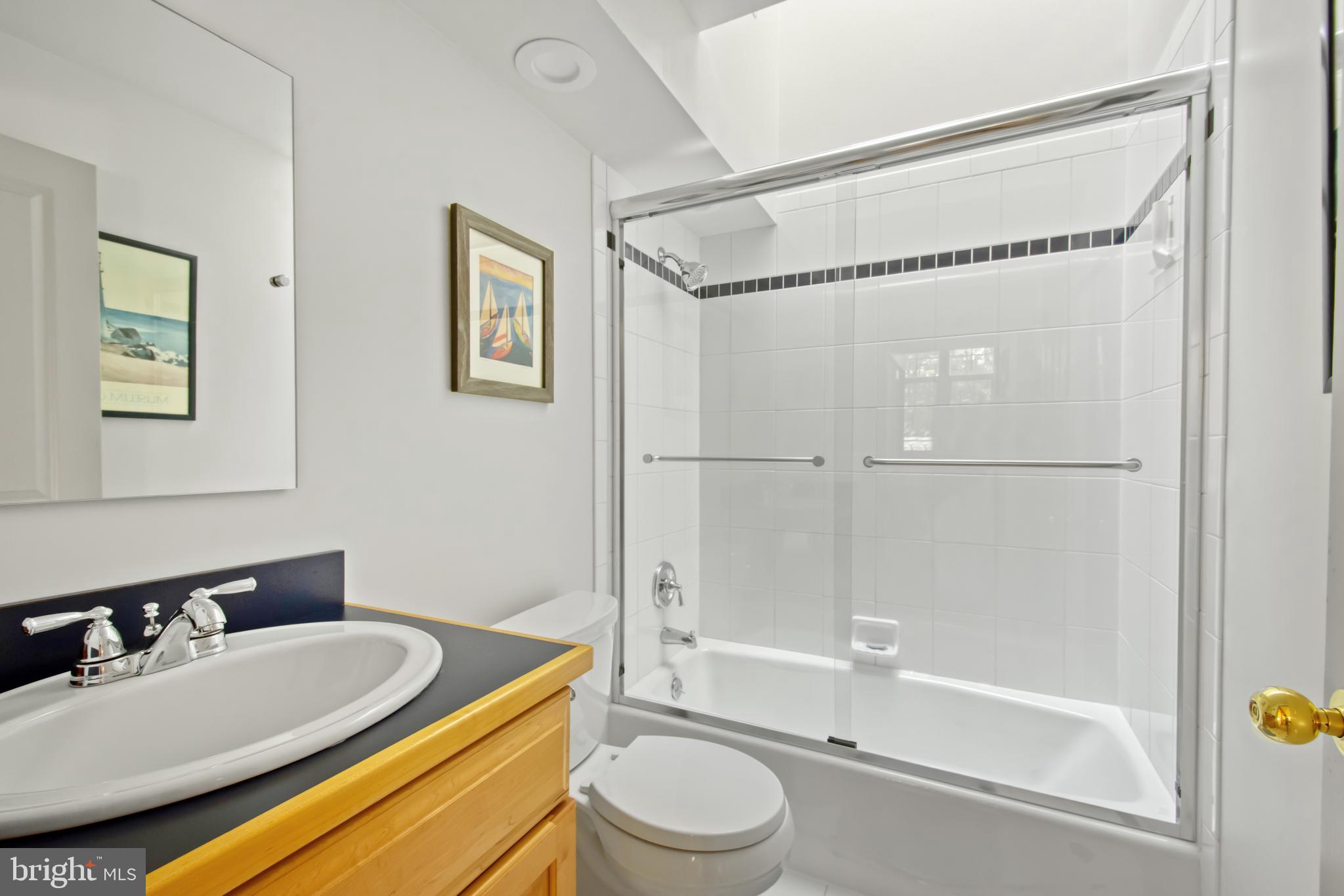 201 Biggs Purchase Lane Lothian, MD 20711 - Photo 28 of 42 a bathroom with a sink a toilet and a bathtub