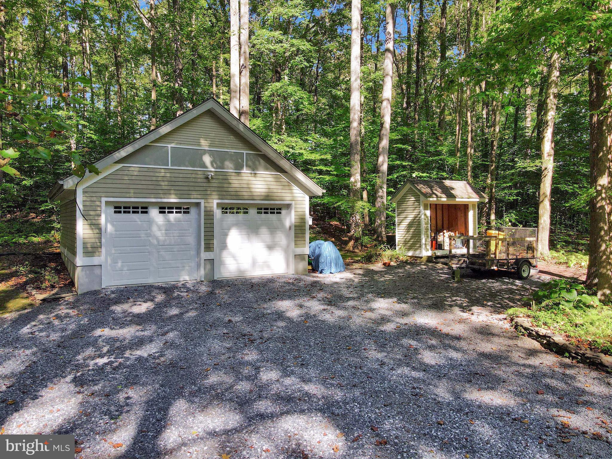 201 Biggs Purchase Lane Lothian, MD 20711 - Photo 40 of 42 a front view of a house with a yard and garage