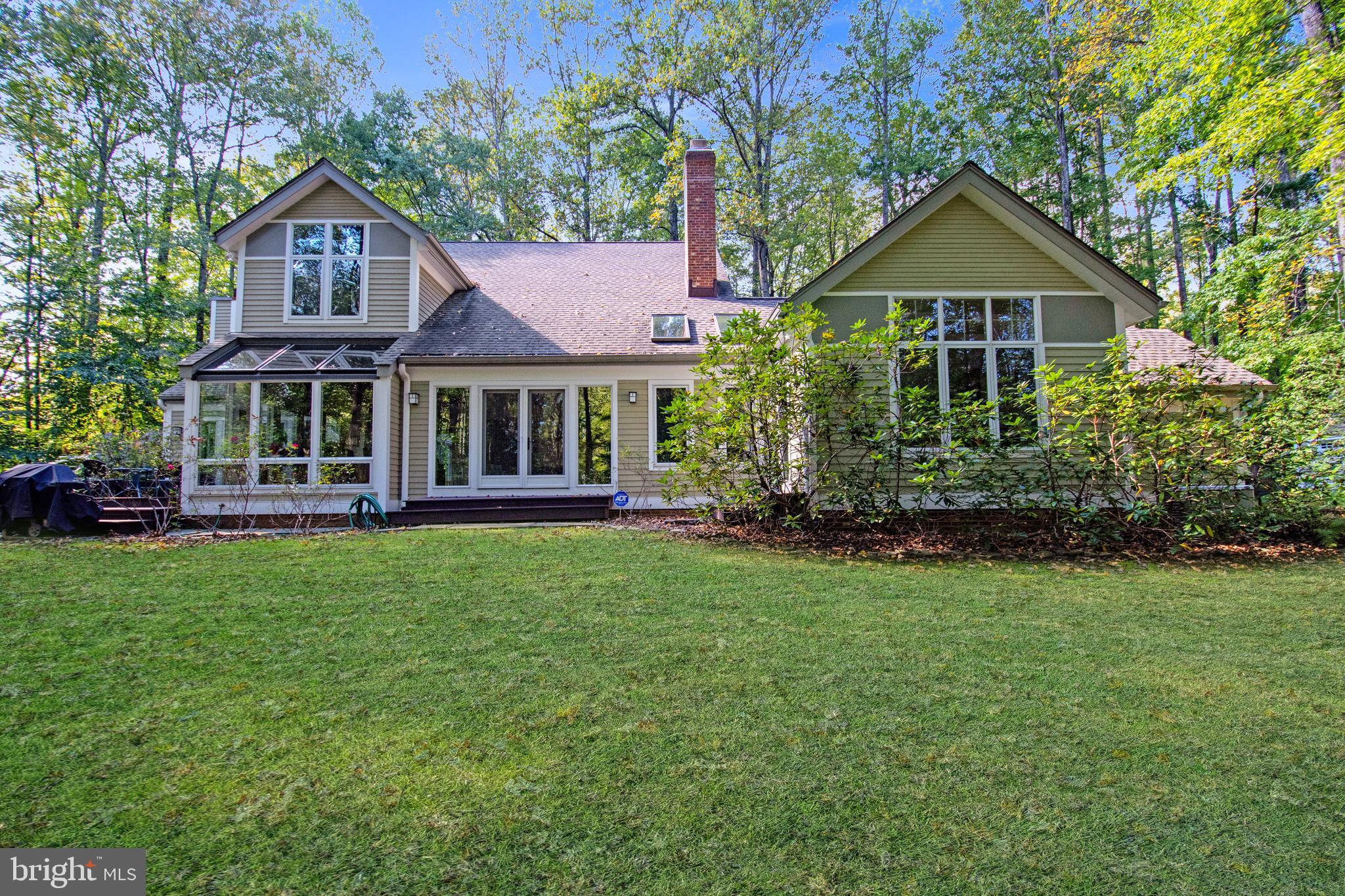 201 Biggs Purchase Lane Lothian, MD 20711 - Photo 4 of 42 a front view of a house with a yard and green space