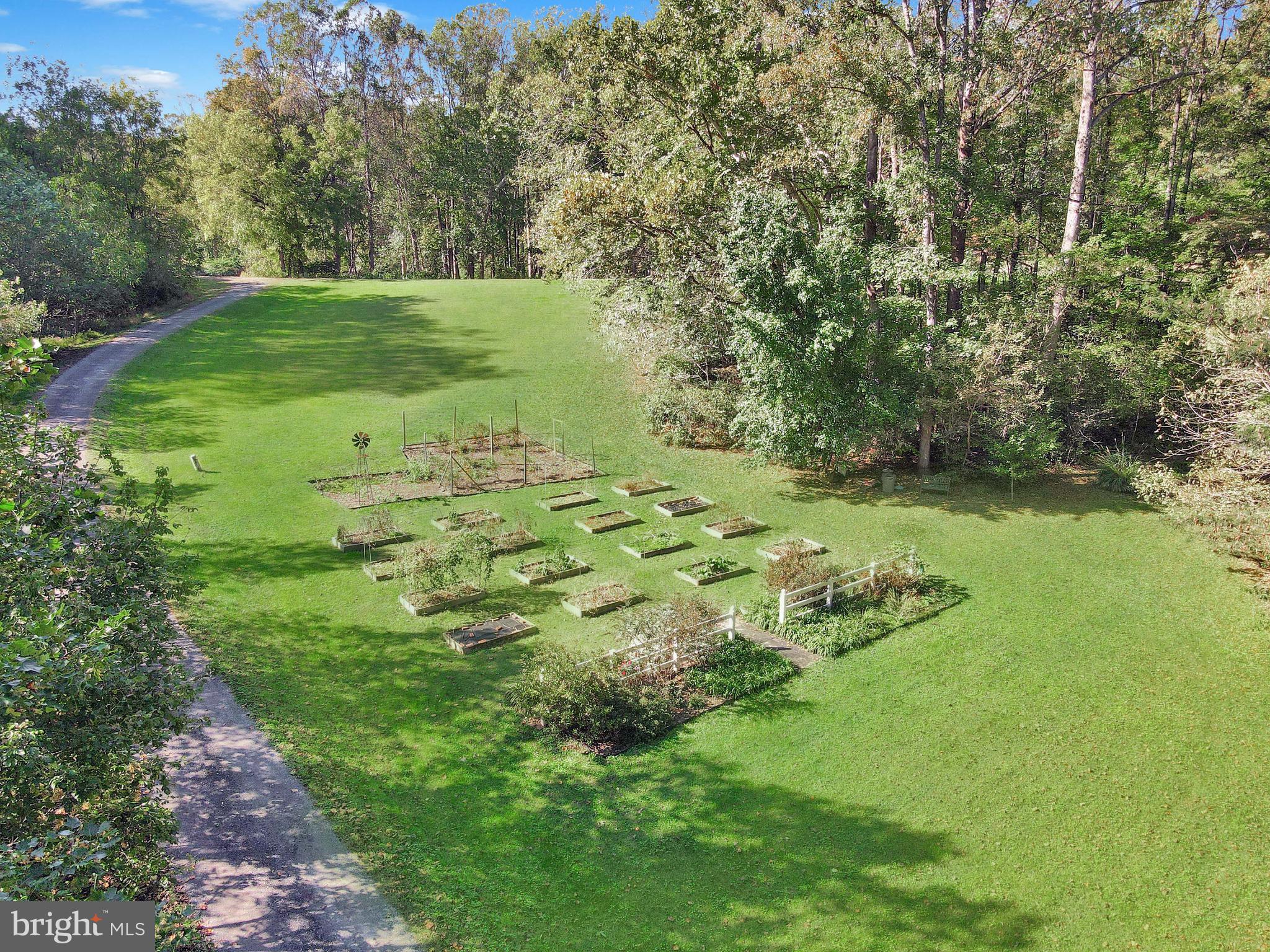 201 Biggs Purchase Lane Lothian, MD 20711 - Photo 42 of 42 a garden view with a lake