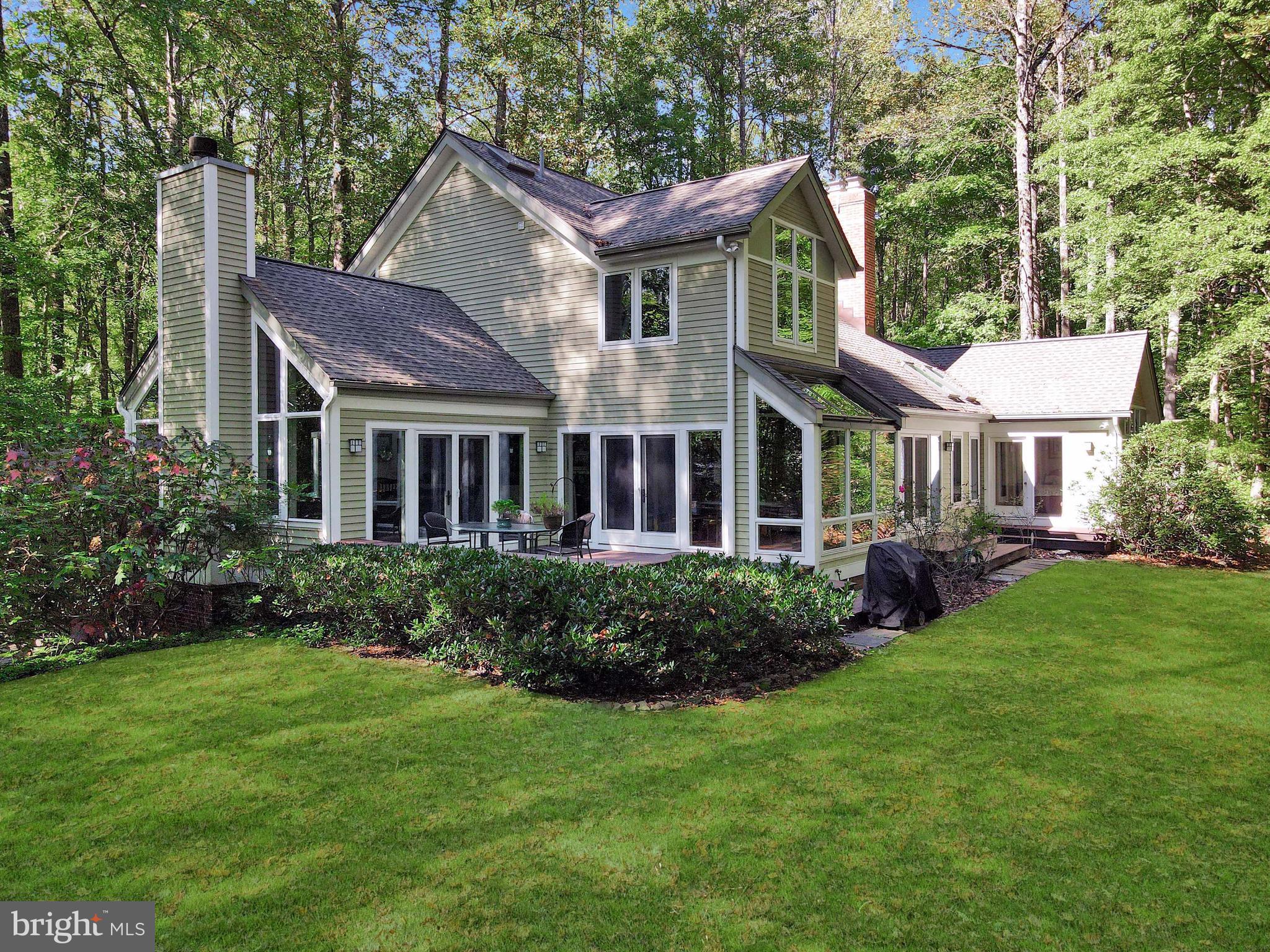 201 Biggs Purchase Lane Lothian, MD 20711 - Photo 5 of 42 a view of a house with a yard and plants