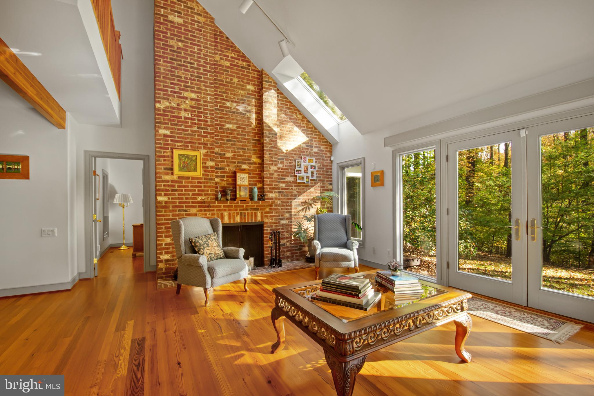 201 Biggs Purchase Lane Lothian, MD 20711 - Photo 7 of 42 a living room with fireplace furniture and a large window