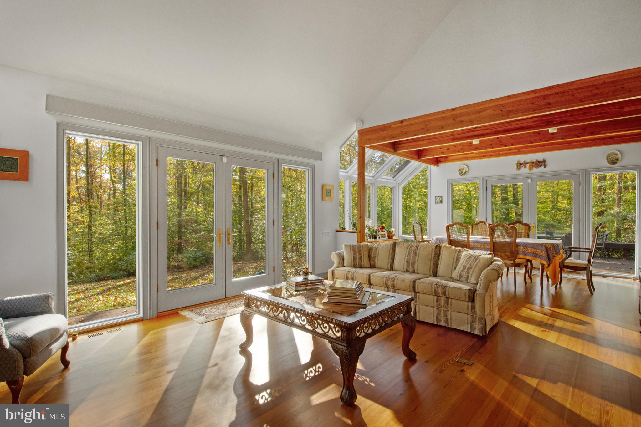 201 Biggs Purchase Lane Lothian, MD 20711 - Photo 8 of 42 a living room with furniture and a floor to ceiling window