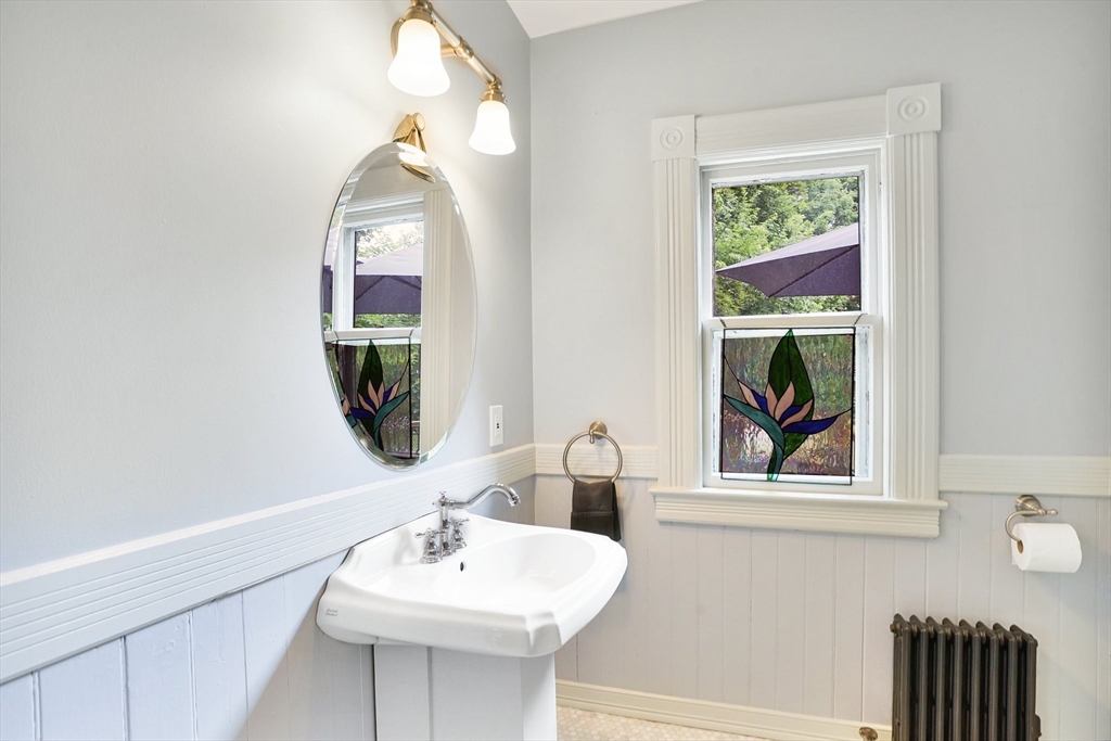 161 Longhill Street Springfield, MA 01108 - Photo 17 of 40 a bathroom with a sink and a mirror