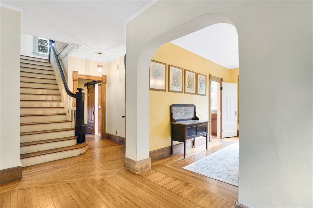 161 Longhill Street Springfield, MA 01108 - Photo 18 of 40 a view of a hallway with wooden floor and staircase
