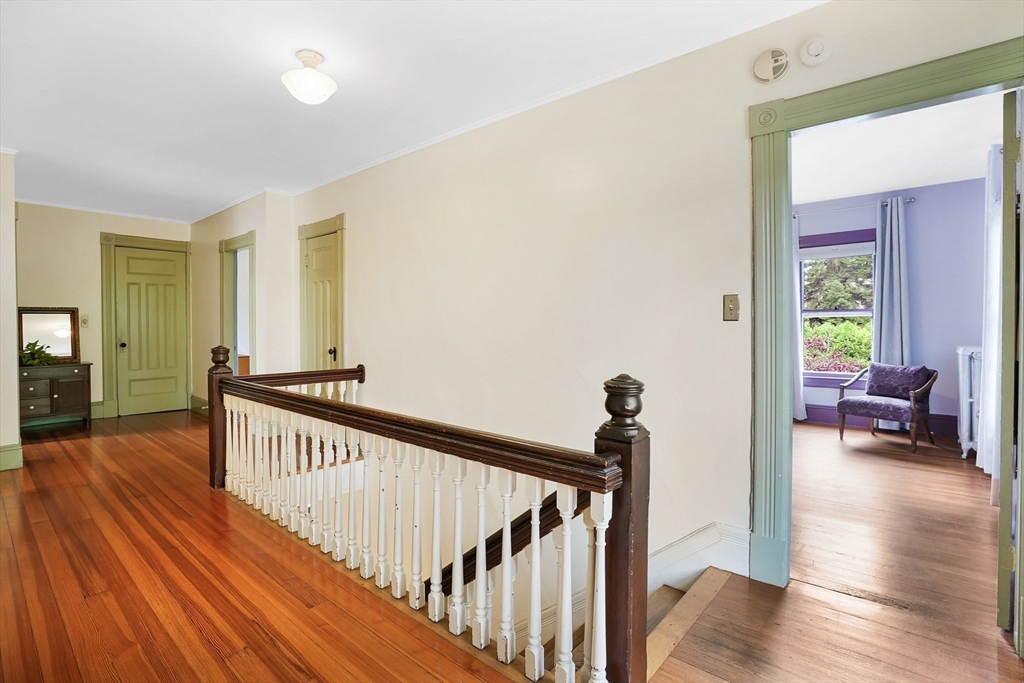 161 Longhill Street Springfield, MA 01108 - Photo 23 of 40 a view of a hallway with wooden floor and stairs