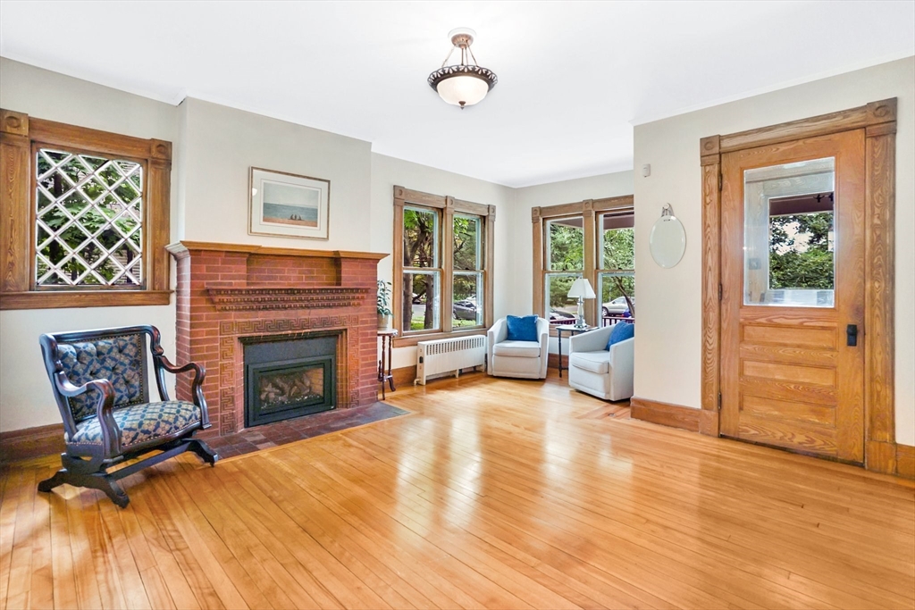 161 Longhill Street Springfield, MA 01108 - Photo 3 of 40 a living room with furniture and a fireplace