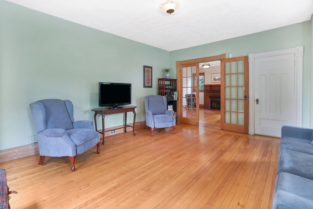 161 Longhill Street Springfield, MA 01108 - Photo 7 of 40 a living room with furniture and a flat screen tv