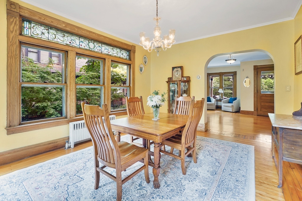 161 Longhill Street Springfield, MA 01108 - Photo 9 of 40 a dining room with furniture a chandelier and wooden floor