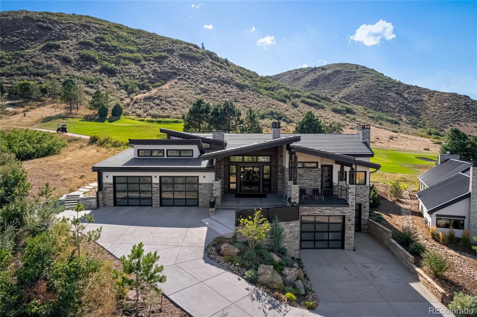 7833 Galileo Way Littleton, CO 80125 - Photo 1 of 39 an aerial view of a house with a big yard