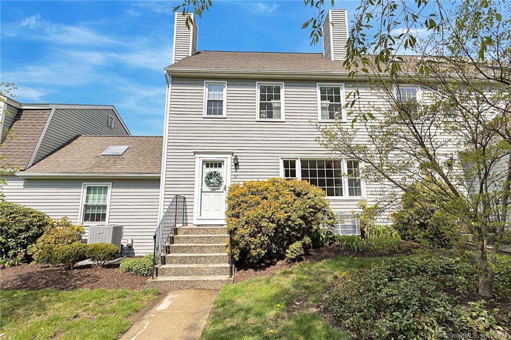 19 Prospect Ridge, Unit 57 Ridgefield, CT 06877 - Photo 1 of 1 a view of a house with a yard