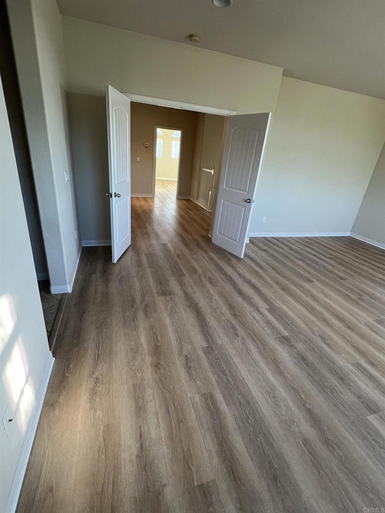 3422 Arborview Drive San Marcos, CA 92078 - Photo 10 of 21 a view of a room with wooden floor and staircase