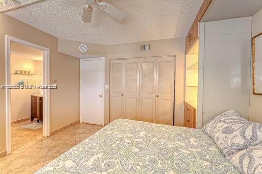 3772 Inverrary Boulevard, Unit 201 Lauderhill, FL 33319 - Photo 20 of 35 a bedroom with a bed and a window