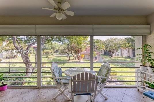 3772 Inverrary Boulevard, Unit 201 Lauderhill, FL 33319 - Photo 22 of 35 a view of a porch and chairs