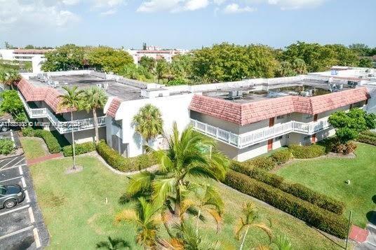 3772 Inverrary Boulevard, Unit 201 Lauderhill, FL 33319 - Photo 32 of 35 a view of a swimming pool with a patio