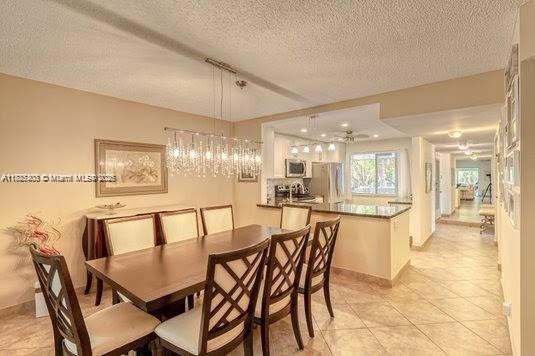 3772 Inverrary Boulevard, Unit 201 Lauderhill, FL 33319 - Photo 7 of 35 a view of a dining room with furniture and wooden floor
