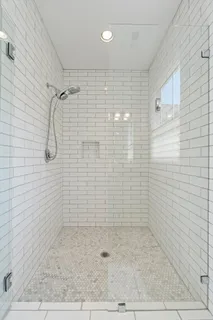 a bathroom with double sink and a mirror