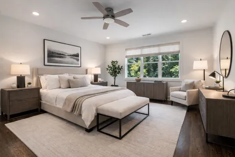 a spacious bedroom with a large bed and a couch