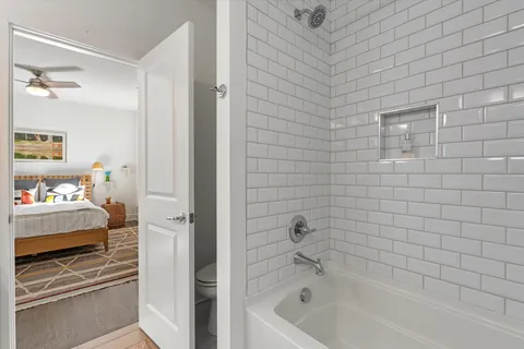 a bathroom with a bathtub and a shower