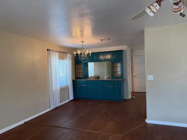 a kitchen with stainless steel appliances granite countertop a refrigerator a sink a stove a refrigerator and cabinets