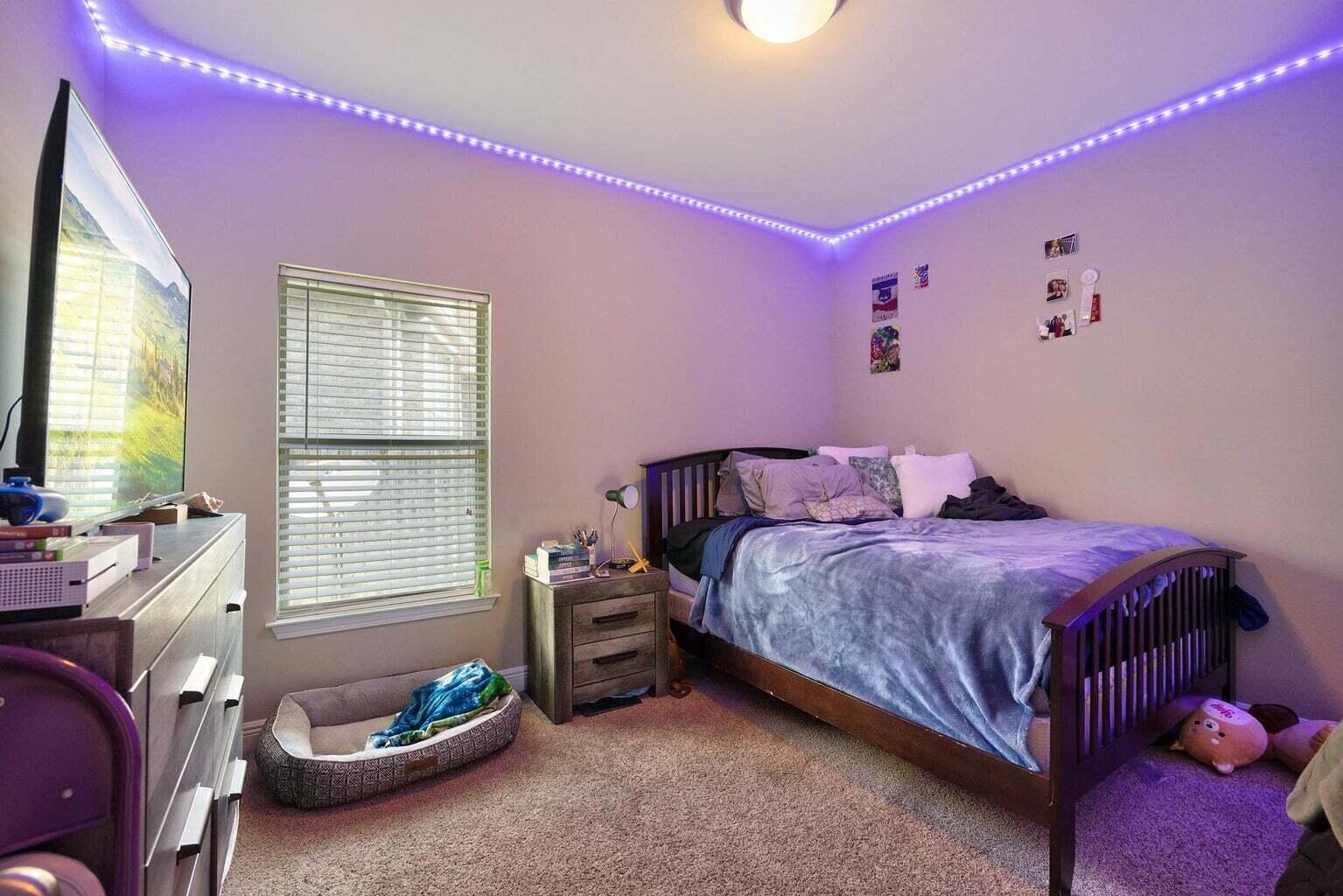 607 Rowan Circle Crestview, FL 32536 - Photo 17 of 27 a bedroom with a bed and a window