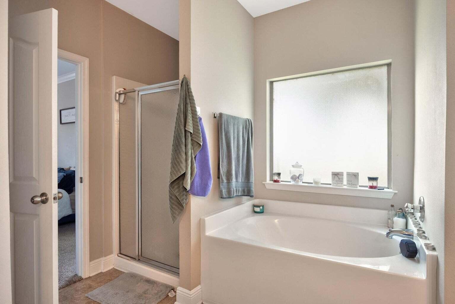 607 Rowan Circle Crestview, FL 32536 - Photo 21 of 27 a white bath tub sitting next to a bathroom