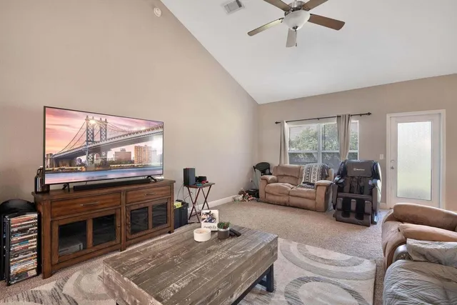 a living room with furniture and a fireplace