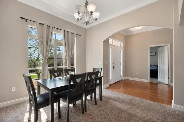 a view of a dining room with furniture window and outside view