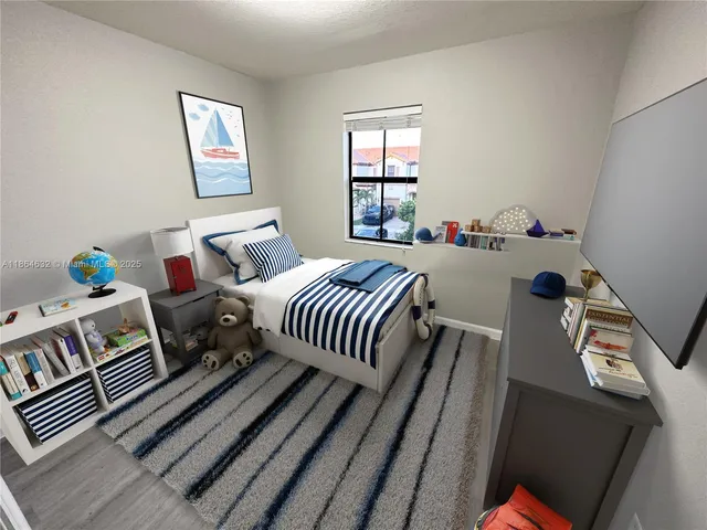 a bedroom with furniture and a window