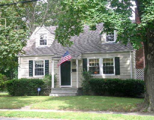 663 South Pine Creek Road Fairfield, CT 06824 - Photo 1 of 1 a front view of a house with a yard