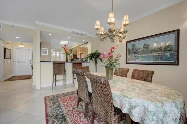 a view of an outside dining space with a table and chairs