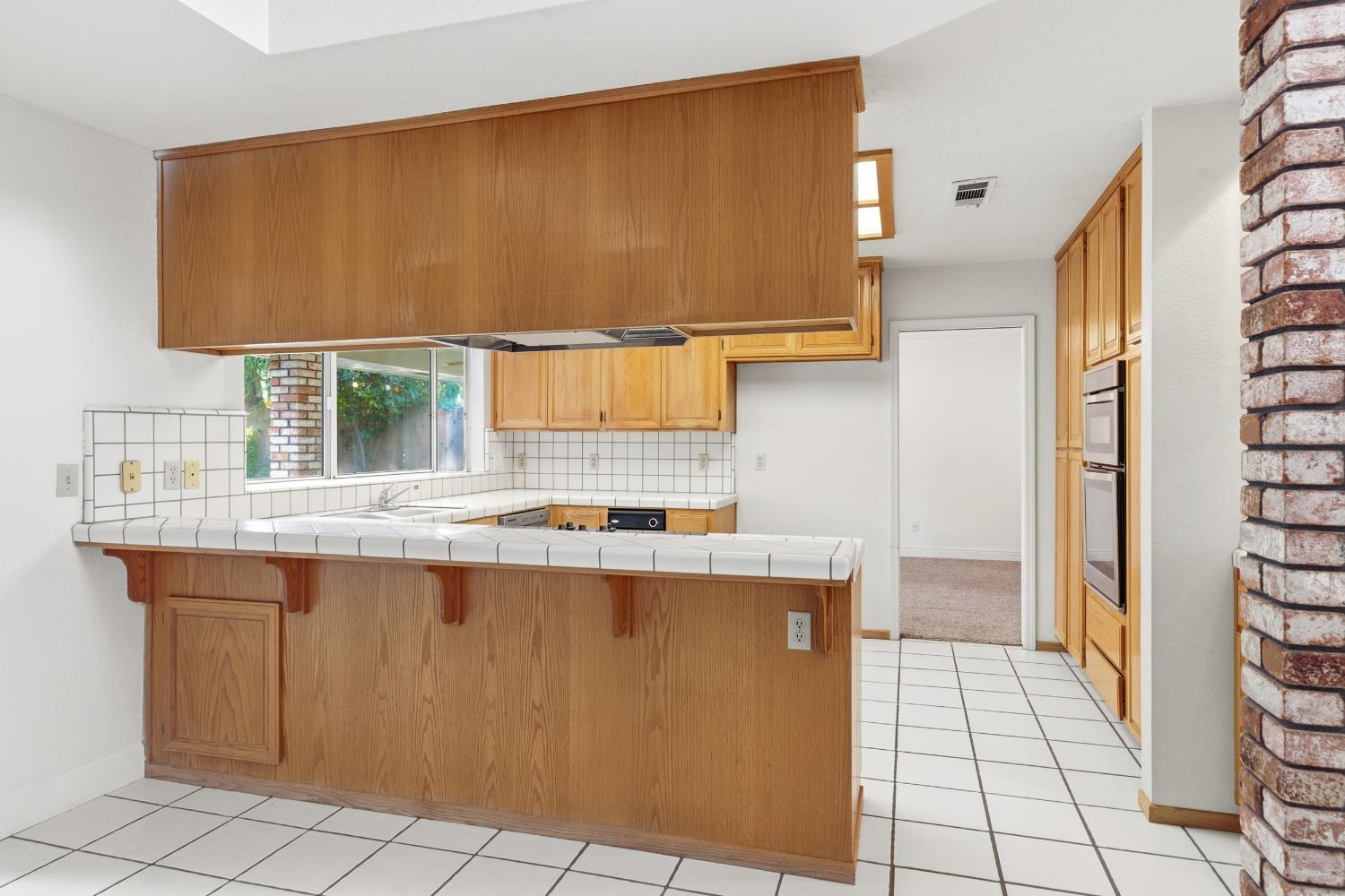 2304 Van Der Goes Way Modesto, CA 95356 - Photo 16 of 42 a view of kitchen with stainless steel appliances granite countertop a sink and a cabinets