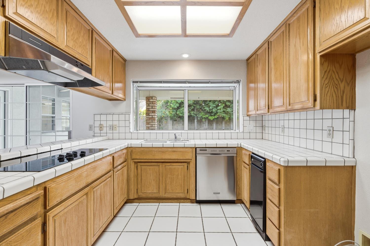 2304 Van Der Goes Way Modesto, CA 95356 - Photo 18 of 42 a kitchen with a sink and large window