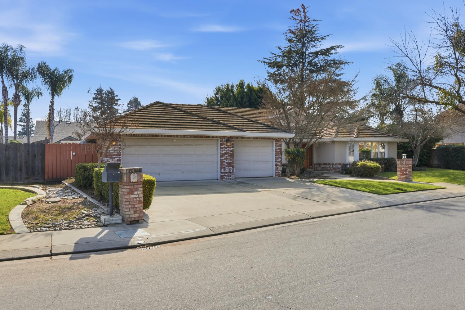 2304 Van Der Goes Way Modesto, CA 95356 - Photo 5 of 42 a front view of a house with a yard and garage