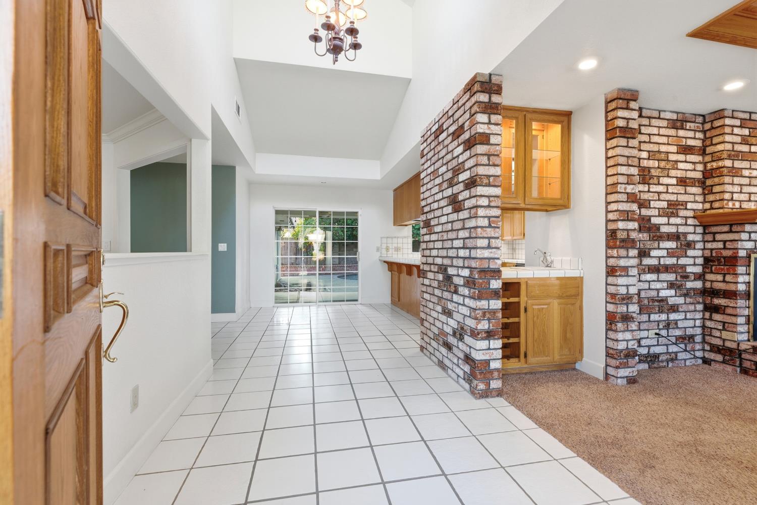 2304 Van Der Goes Way Modesto, CA 95356 - Photo 7 of 42 a view of an entryway with paintings on the wall