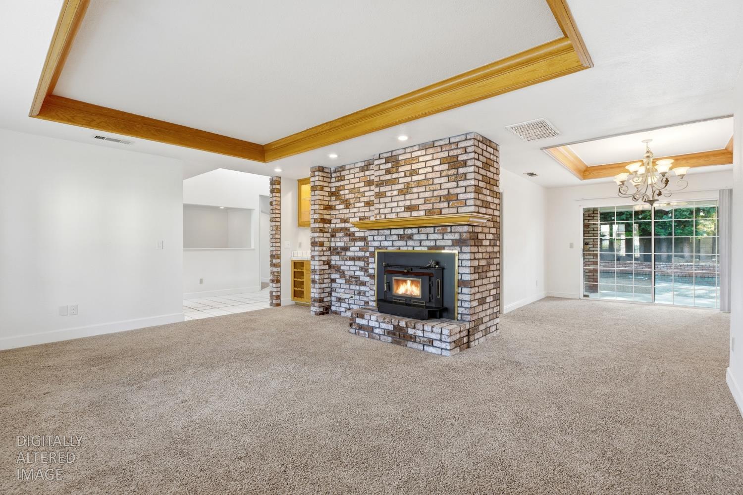 2304 Van Der Goes Way Modesto, CA 95356 - Photo 9 of 42 a view of empty room with a fireplace