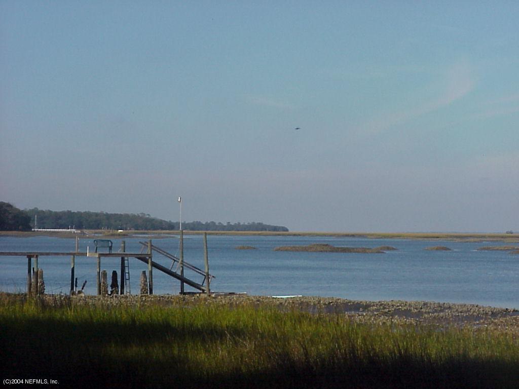 3767 Maranatha Road Yulee, FL 32097 - Photo 1 of 3 a view of an ocean and beach