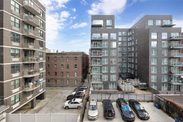 a table and chairs in a room and a book shelf