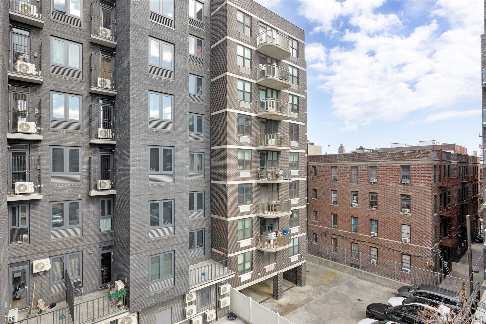 148-36 89th Avenue, Unit 204 Queens, NY 11435 - Photo 29 of 32 a view of buildings with a street