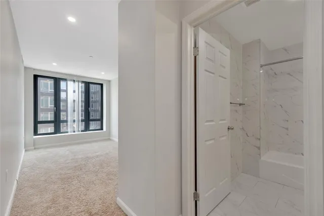 a view of an empty room with a window