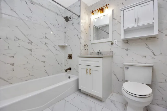 a bathroom with a sink toilet and bathtub