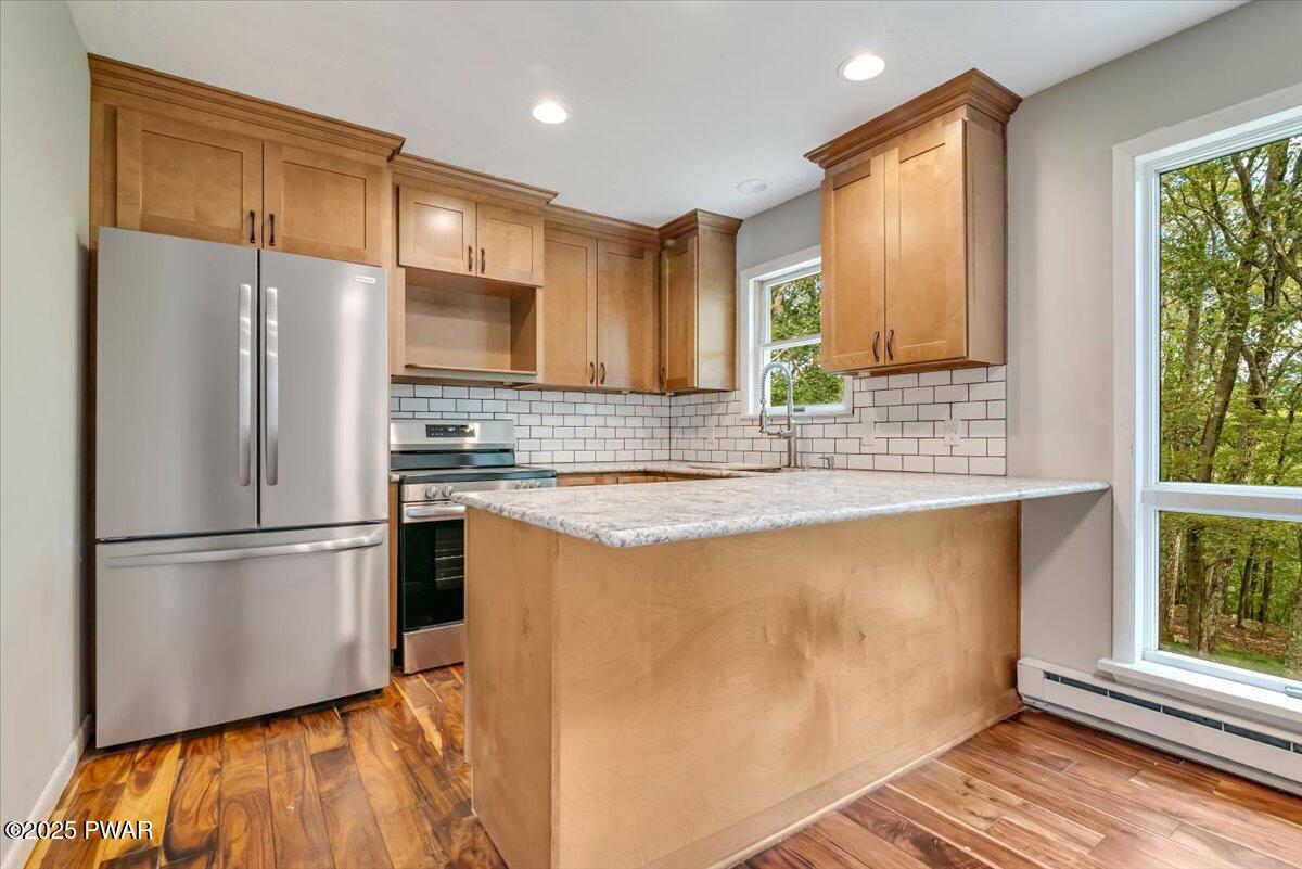 107 Kiel Road Milford, PA 18337 - Photo 20 of 71 a kitchen with stainless steel appliances granite countertop a refrigerator a sink and a stove