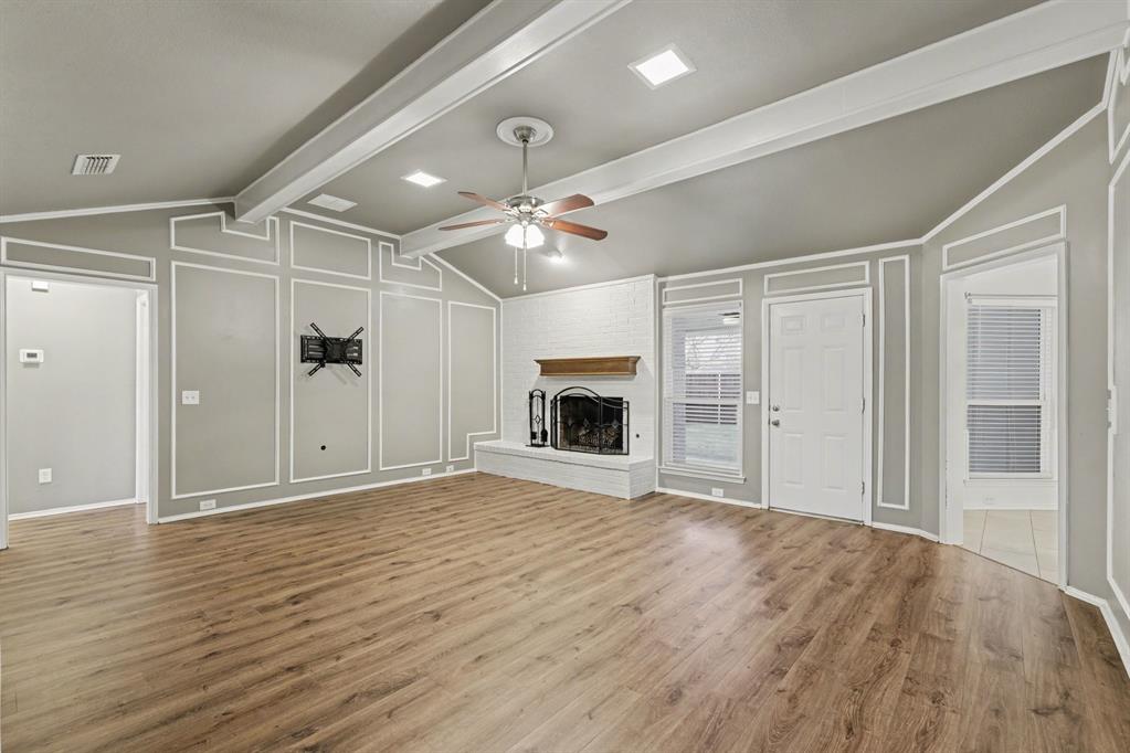 908 Thoreau Lane Allen, TX 75002 - Photo 11 of 31 a view of an empty room with a fireplace and a window