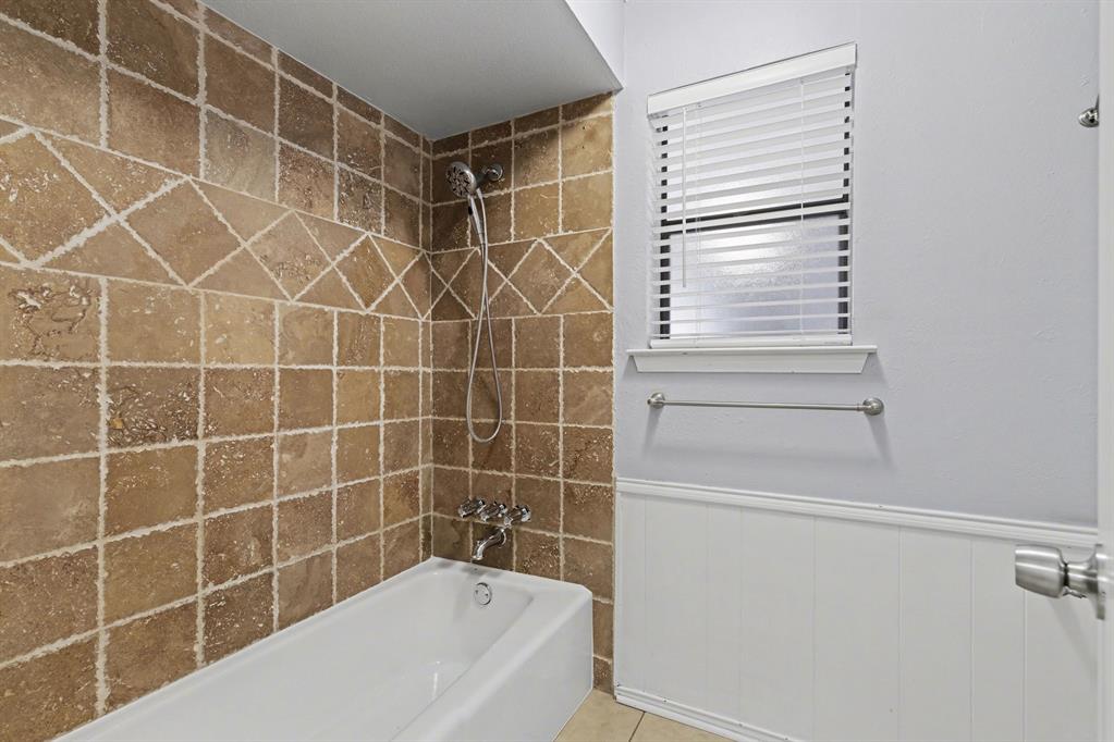 908 Thoreau Lane Allen, TX 75002 - Photo 20 of 31 a bathroom with a bathtub with a shower