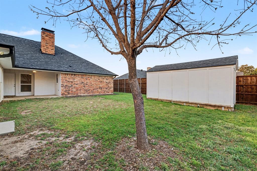 908 Thoreau Lane Allen, TX 75002 - Photo 27 of 31 a front view of a house with garden