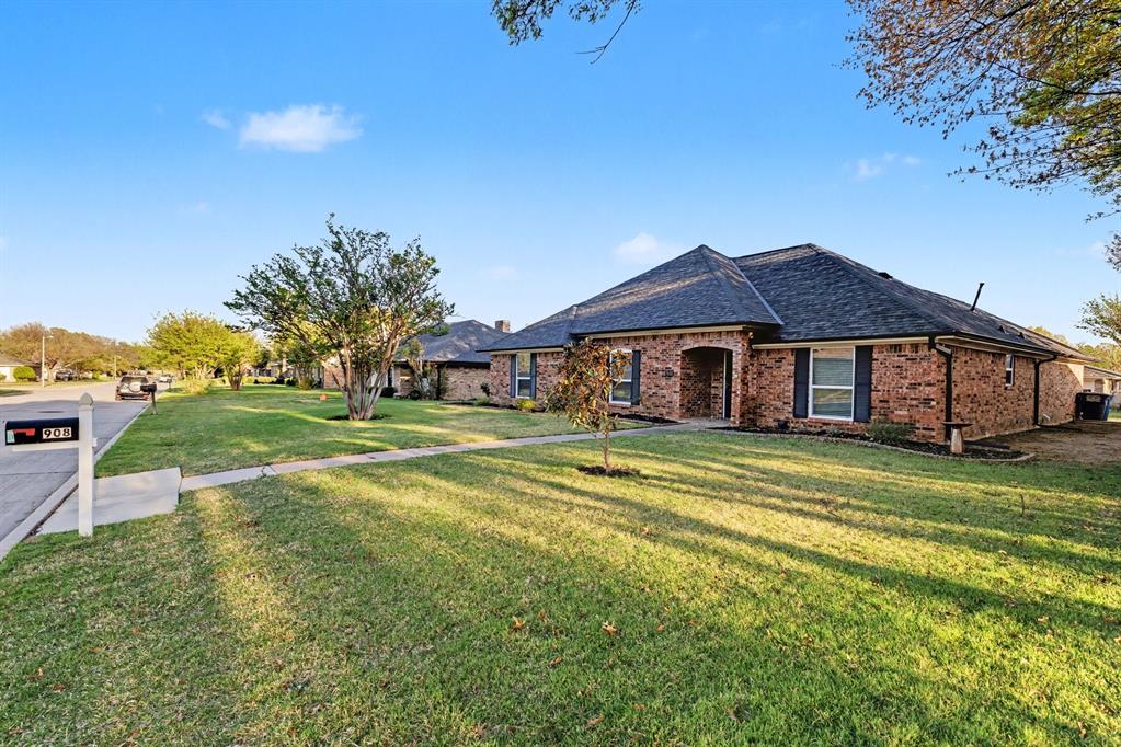 908 Thoreau Lane Allen, TX 75002 - Photo 30 of 31 a front view of a house with a yard